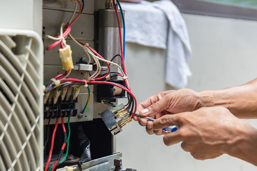 Technician performing furnace repair
